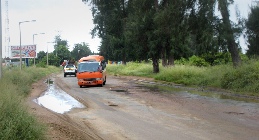 Traffic avoiding potholes outside Maputo